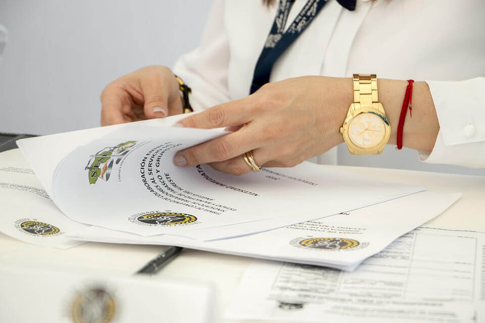 A person listing documents 