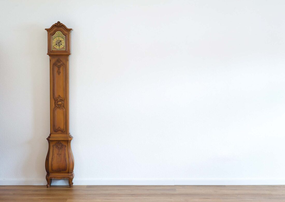 Wood color grandmother clock for photo background left side