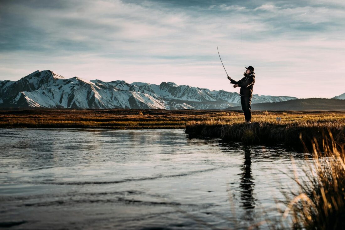 Man enjoying a peaceful day fishing by the shore