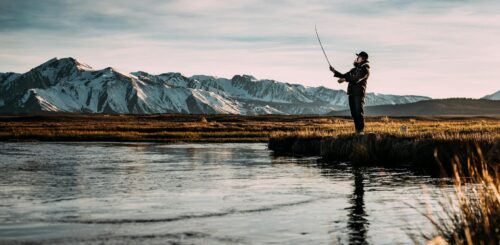Man enjoying a peaceful day fishing by the shore