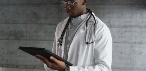 A Doctor Using a Tablet