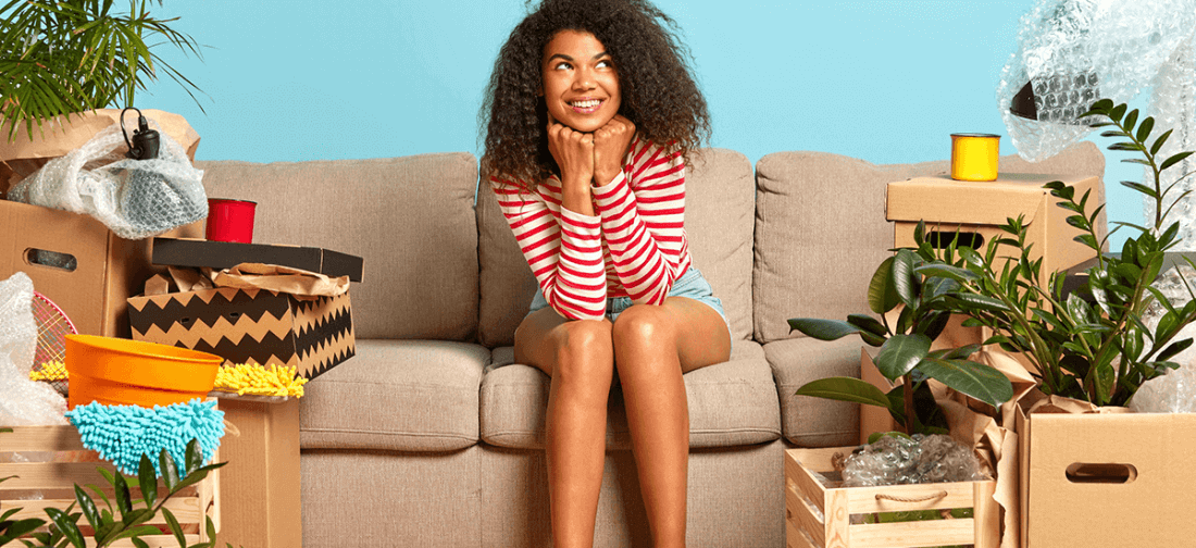 Woman sitting on the couch smiling 