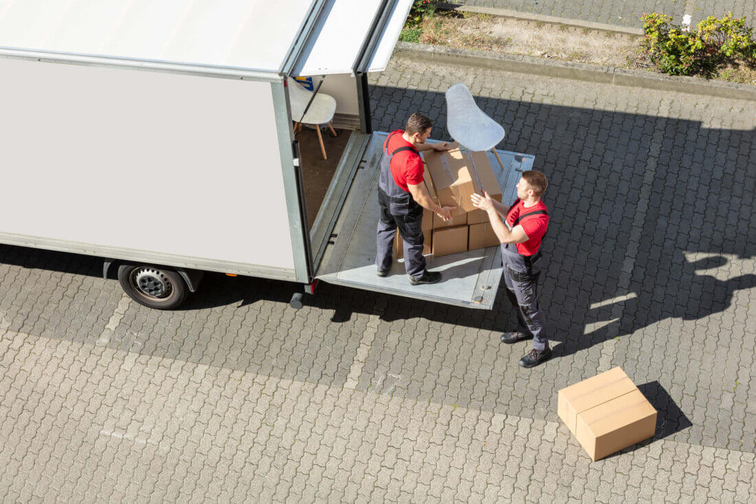 Professional movers loading the truck