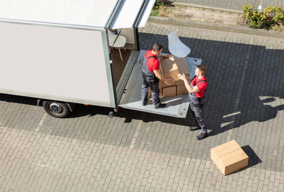 Professional movers loading the truck