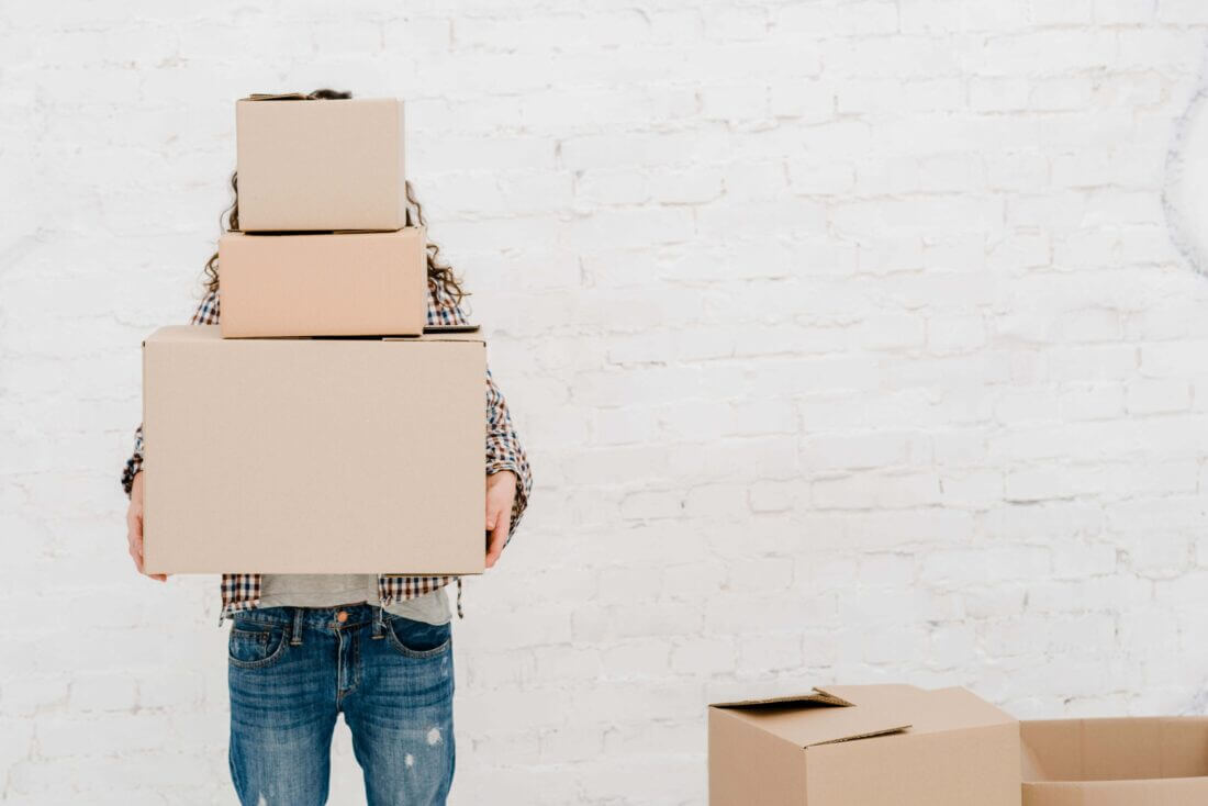 a person holding boxes.