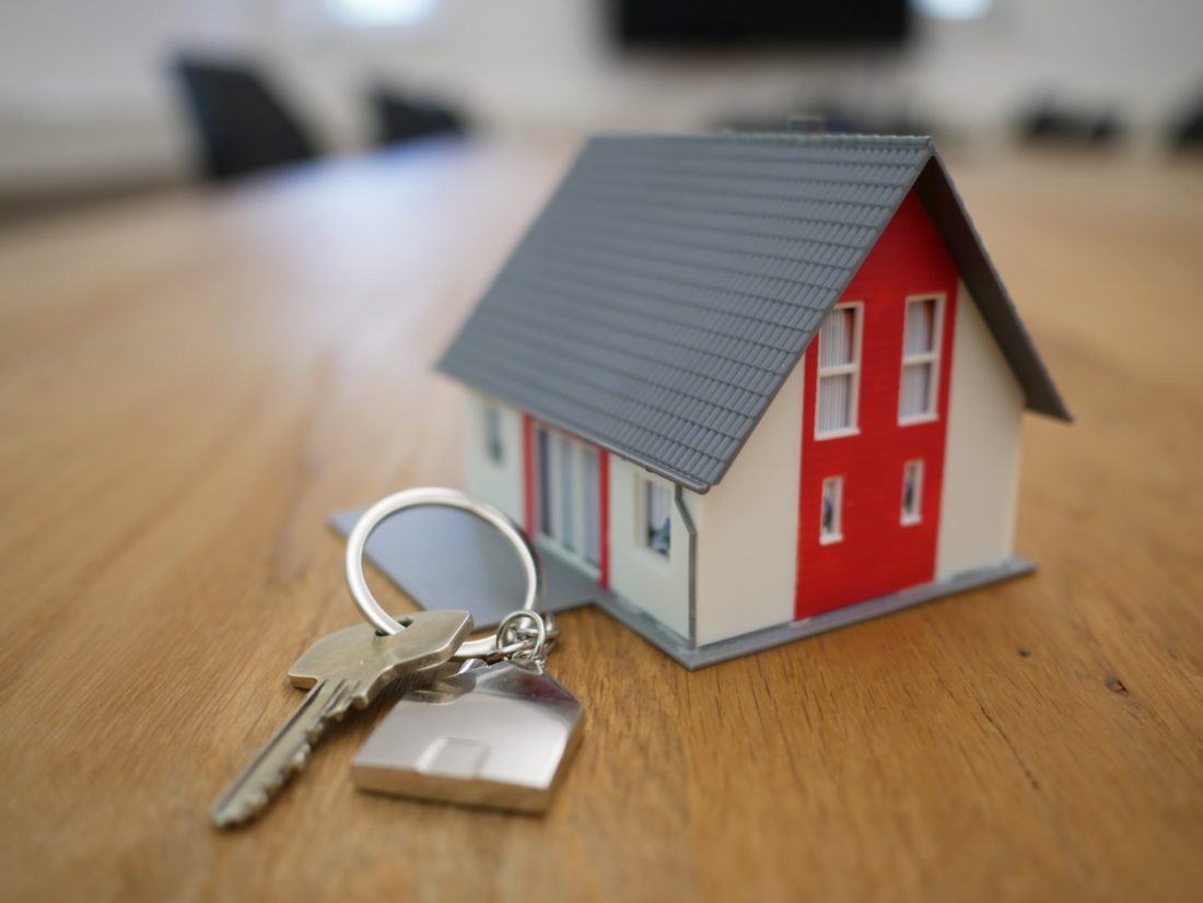 A model house next to keys 