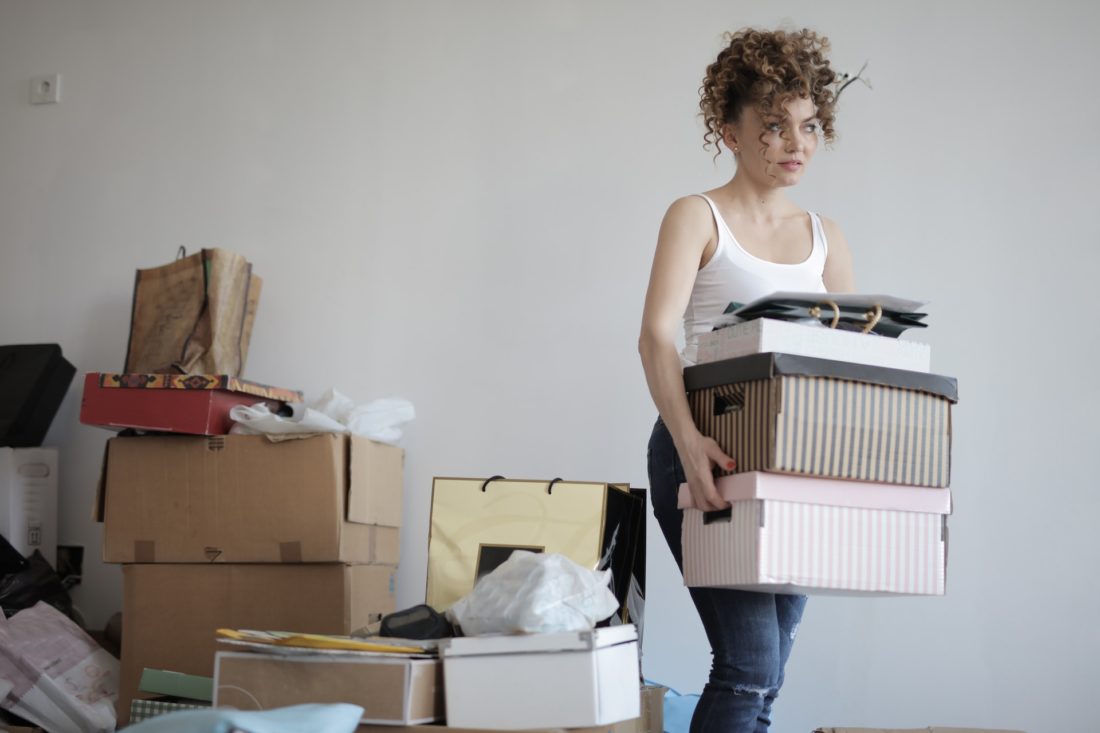 A woman packing before long-distance moving