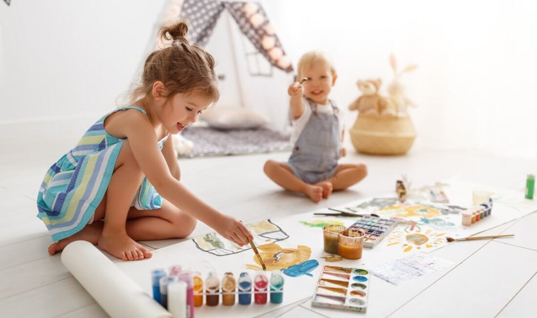 Two kids painting
