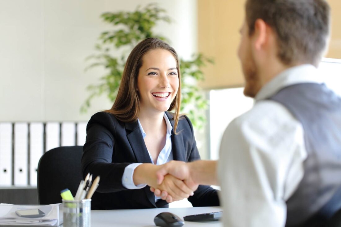 People shaking hands during a job interview