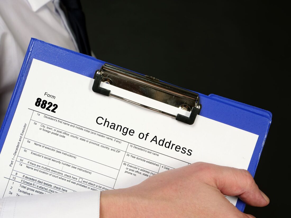 Person filling out the change of address form