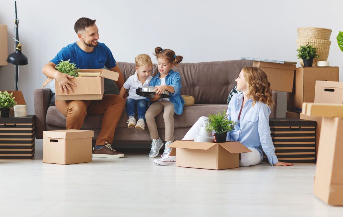 A family of four unpacking after cross-country moving