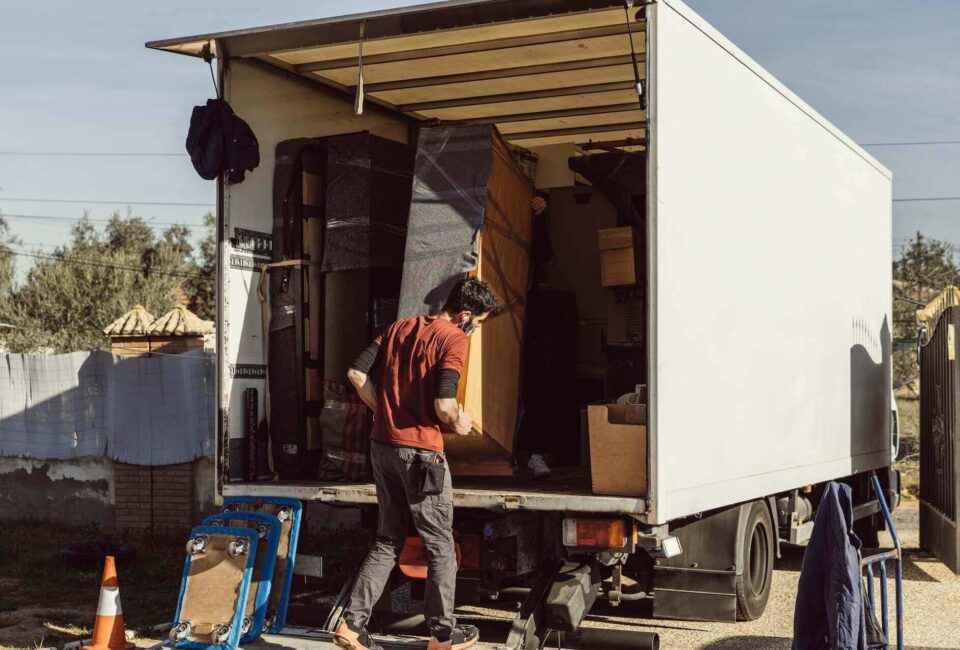 Man packing a truck before long-distance moving