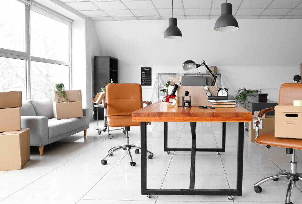 An office space with boxes waiting for cross-country movers
