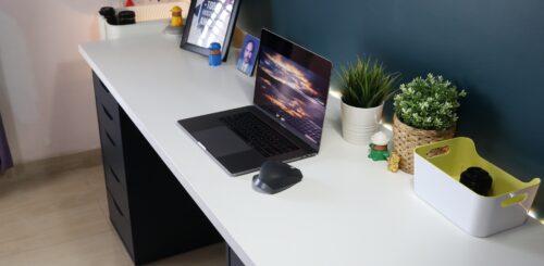 White desk with a laptop on it