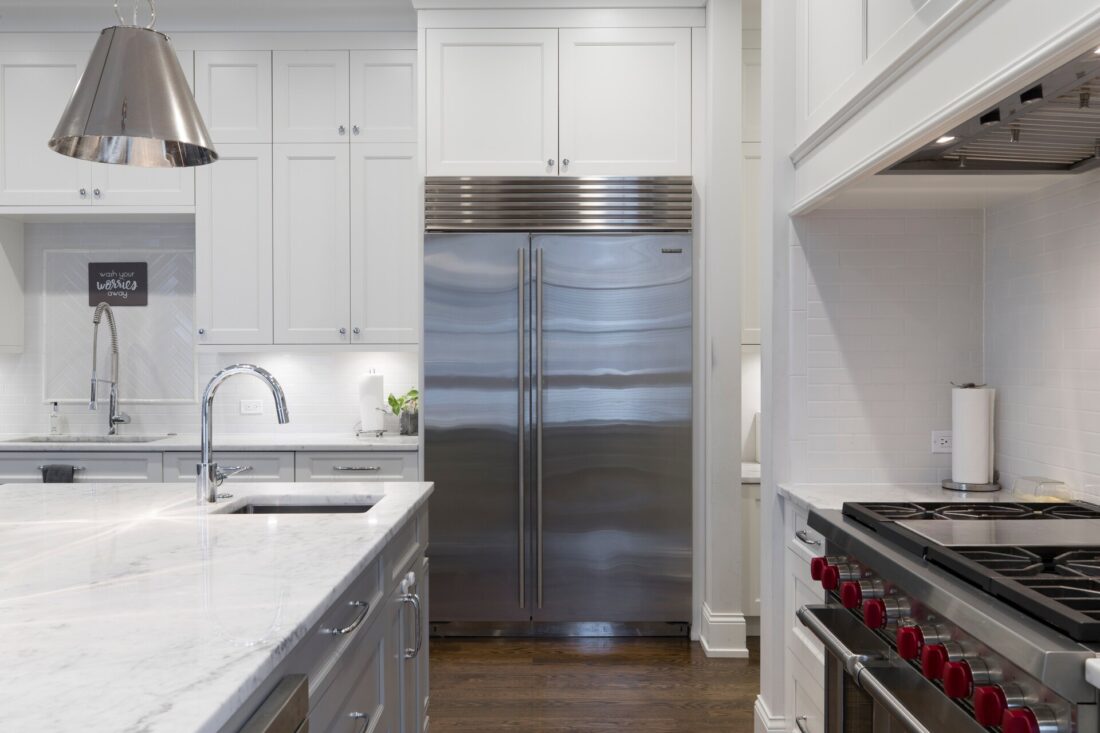 Stainless steel fridge in a white kitchen 